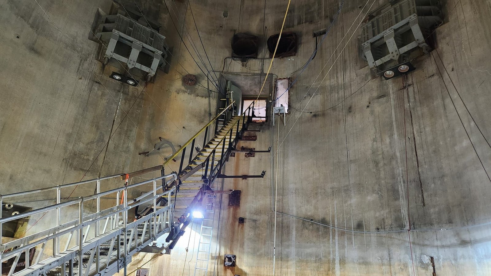 The stairs down to the dive platform give you a real sense of the silo’s scale, with each level drawing you deeper into the quiet, steel-lined space before the dive begins.