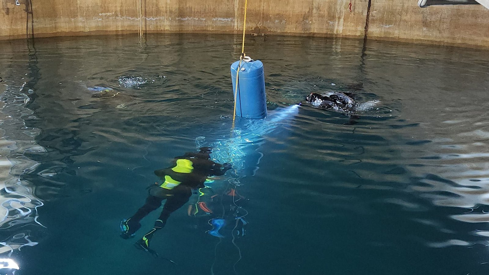 Divers gearing up and ready to descend into Valhalla, with tanks on, lights prepared, and that mix of focus and anticipation that always comes just before entry.