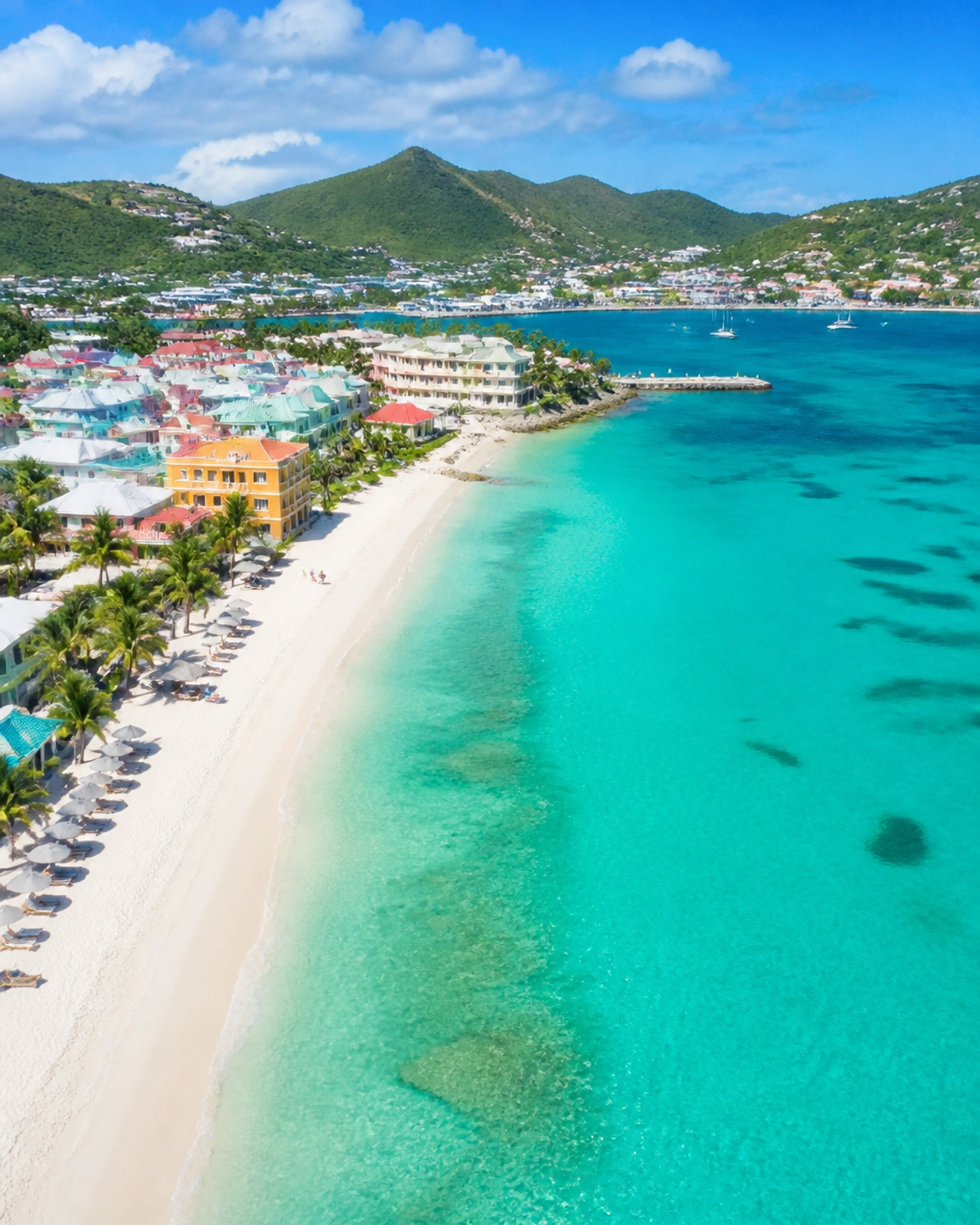 Aerial view of a tropical beach in Sint Maarten with vibrant turquoise water