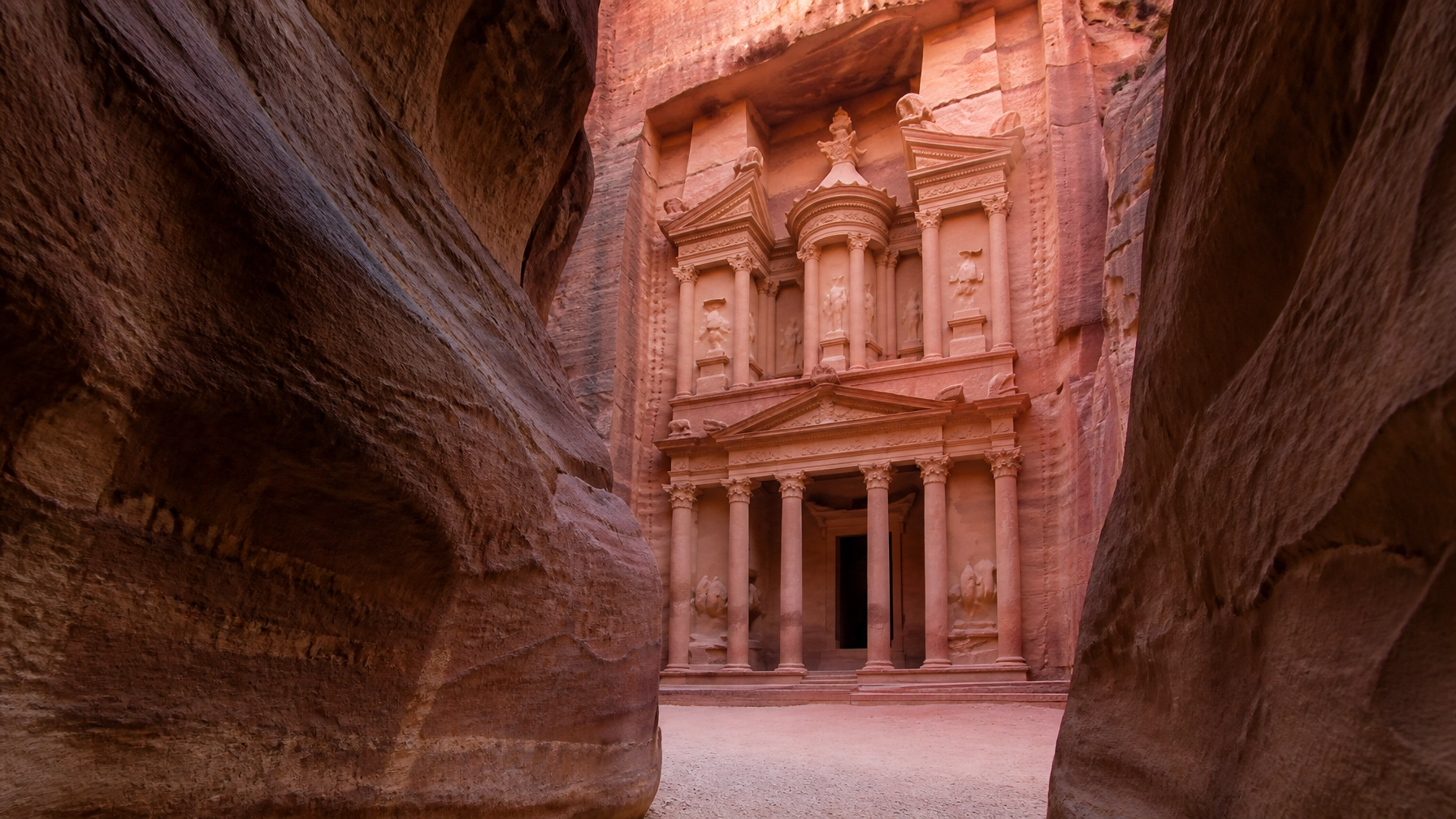 The ancient Treasury at Petra in Jordan seen through the Siq canyon